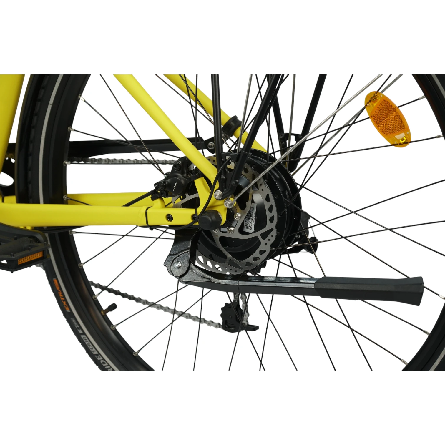 E-Bikes kaufen – Nahaufnahme der linken Hinterradseite des gelben Eonic One Comfort Limited E-Bikes mit Fokus auf die hydraulische Shimano Scheibenbremse, den integrierten Hecknabenmotor, den schwarzen Seitenständer und einen gelben Speichenreflektor vor weißem Hintergrund.
